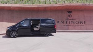 Luxury minivan in front of the Antinori winery entrance at Bargino